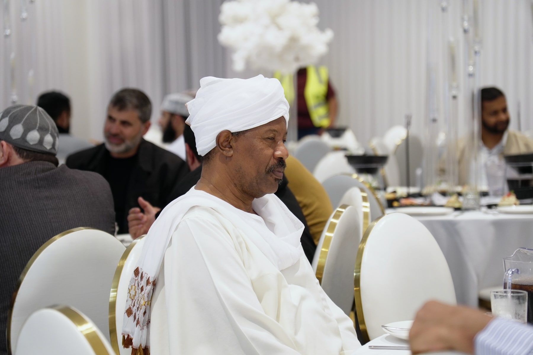 Guest at a reception photographed by Hagos